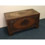 An Edwardian carved camphor wood trunk. Est. £40 -