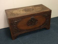 An Edwardian carved camphor wood trunk. Est. £40 -