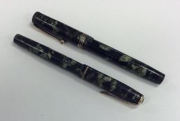 Two Bakelite mounted Parker fountain pens. Est. £2