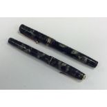 Two Bakelite mounted Parker fountain pens. Est. £2