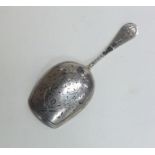A large Russian silver caddy scoop with twisted te