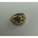A 9 carat textured ring with numerous stones. Appr
