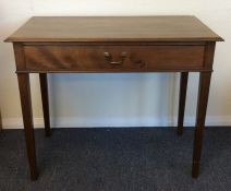 A Georgian mahogany single drawer side table on sq
