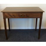 A Georgian mahogany single drawer side table on sq