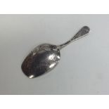 A small Russian silver caddy spoon with floral dec