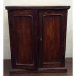 A good mahogany coin cabinet with fitted interior.