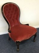 A Victorian button back nursing chair in pink velv
