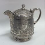 A good quality Persian silver jug with heart decor