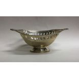 An Edwardian silver sweet dish with shell thumb pi
