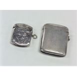 A heavy silver engine turned vesta case together w