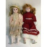 Two dressed 'Heritage Mint' porcelain headed dolls