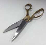 A good pair of heavy brass and steel scissors. Est