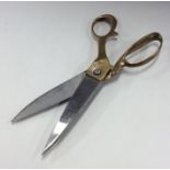 A good pair of heavy brass and steel scissors. Est