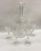 A set of four cut glass spirit glasses together wi