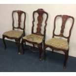 A pair of Dutch marquetry hall chairs of typical d