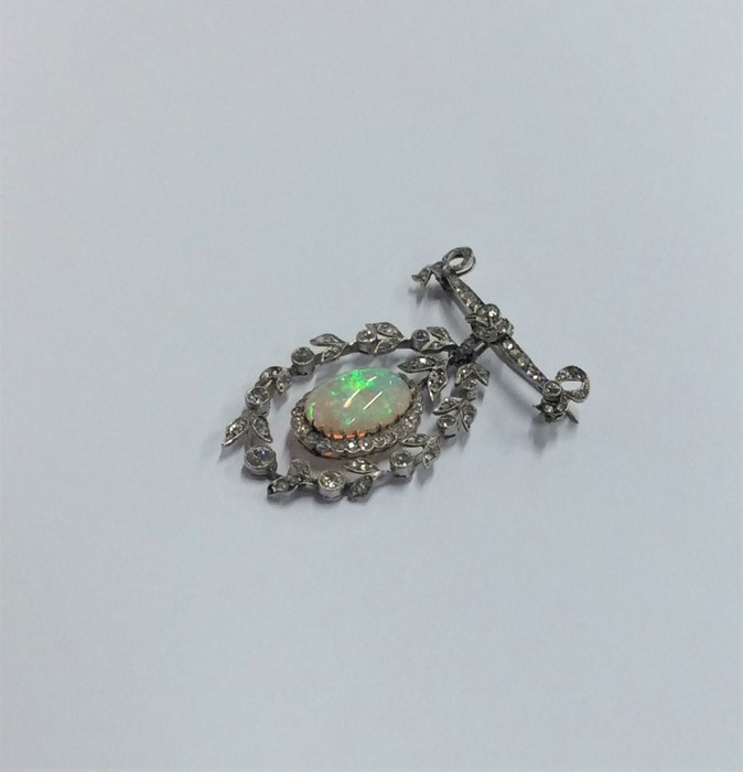 An attractive Victorian opal and diamond brooch wi