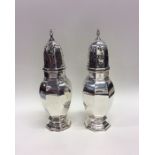 A good pair of large silver casters contained with