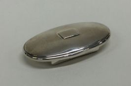 A fancy oval hinged top silver snuff box with gilt