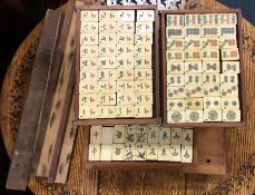 A cased wooden and bone Mahjong set. Est. £50 - £8
