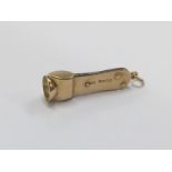 A 15 carat gold cigar cutter with loop mount. Appr