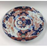 A Japanese Imari charger in blue ground. Approx. 3