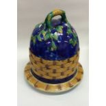 A Majolica cheese dome of wicker design. Est. £30