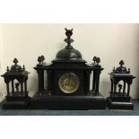 A massive slate clock garniture with Corinthian co