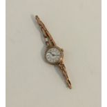 A lady's 9 carat wrist watch on expanding strap. A