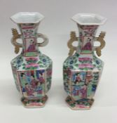 A pair of Canton vases decorated with figures. App