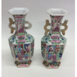 A pair of Canton vases decorated with figures. App