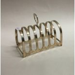 An Edwardian silver toast rack / smartphone dockin