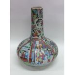 A Canton style baluster shaped vase decorated in b