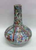 A Canton style baluster shaped vase decorated in b