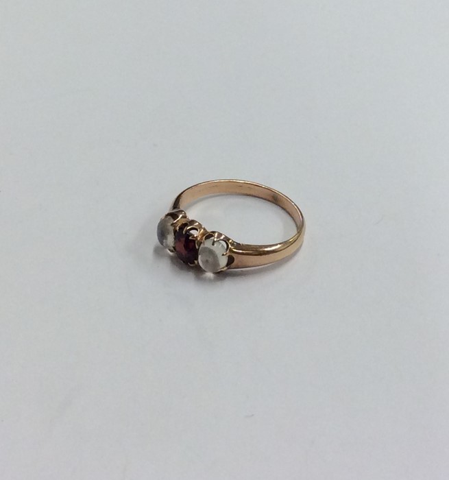 A moonstone and garnet ring in rose gold claw moun - Image 2 of 2