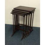 A nest of four mahogany tables. Est. £20 - £30.