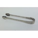 A pair fo Georgian bright cut silver sugar tongs w