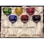 A boxed set of six coloured stemmed glasses. Est.