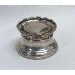 An unusual castle top capstan shaped silver inkwel