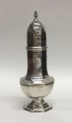 A small hexagonal silver caster on stepped base. A