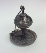 A silver pot pourri with pierced decoration and su