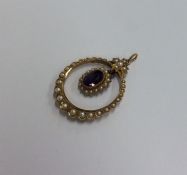 A Victorian amethyst and pearl pendant with loop t