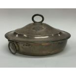 A heavy Edwardian silver tureen and cover with ree