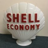 An old Shell Economy Petrol globe of typical form.
