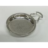 NEWCASTLE: A Georgian silver lemon strainer of typ