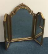 A gilt framed triple mirror with scroll top. Appro