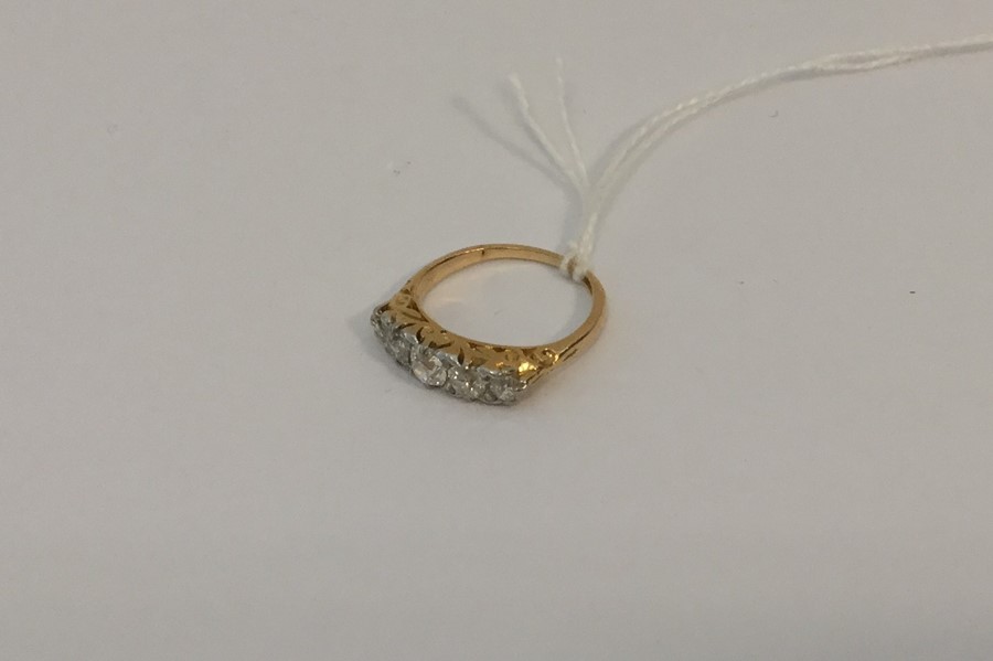 A good diamond five stone ring in 18 carat gold ca