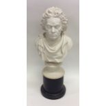 A bust depicting Beethoven on pedestal base. Appro