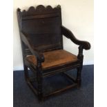 A small early Antique Wainscot oak chair with stre