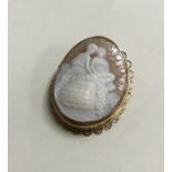A 9 carat oval cameo depicting a romantic scene. A