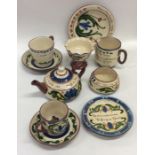 A quantity of Devonware to include a teapot, cups,